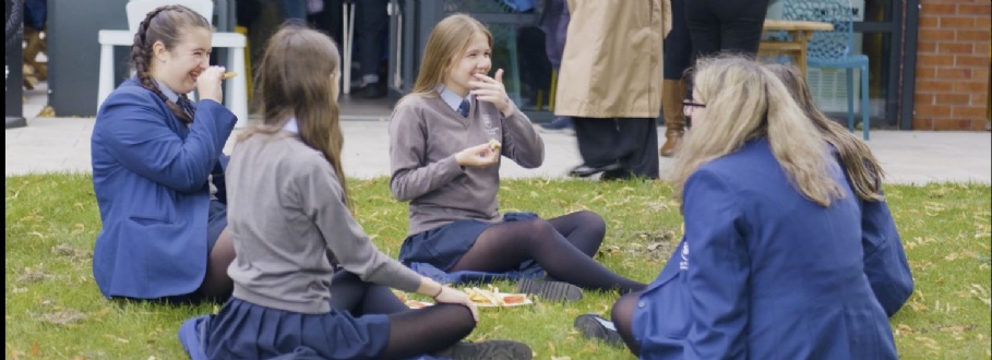 Girls eating lunch on the grass
